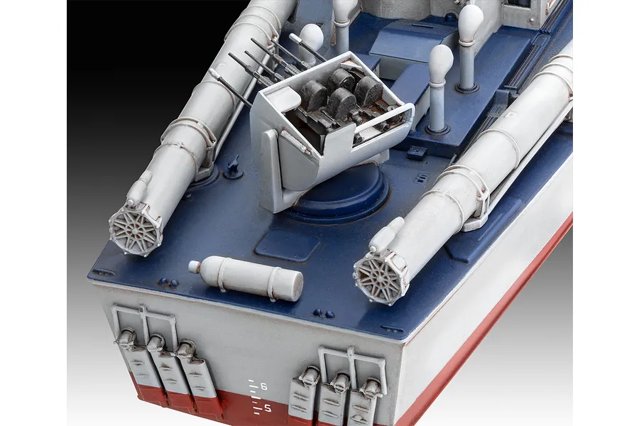 Close-up of a 1/72 scale plastic model PT boat showing the deck, torpedo tubes, and gun turret.