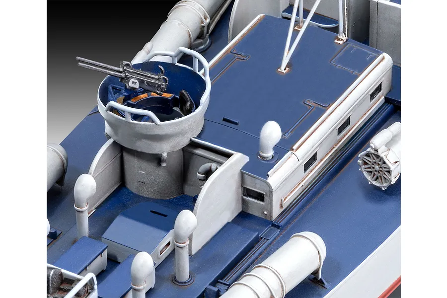 Close-up of the deck of a Revell 1/72 scale PT-160 model boat, showing a machine gun turret, vents, and painted blue and grey surfaces.