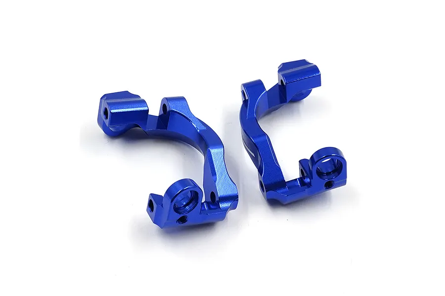 A pair of dark blue anodized aluminium C-hub carriers for RC cars, shown from a top-down perspective on a white background.