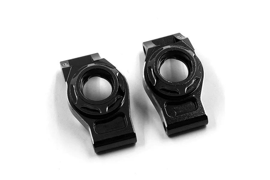 Two black anodized aluminium rear hubs for RC cars by Yeah Racing, shown from a top-down perspective on a white background.