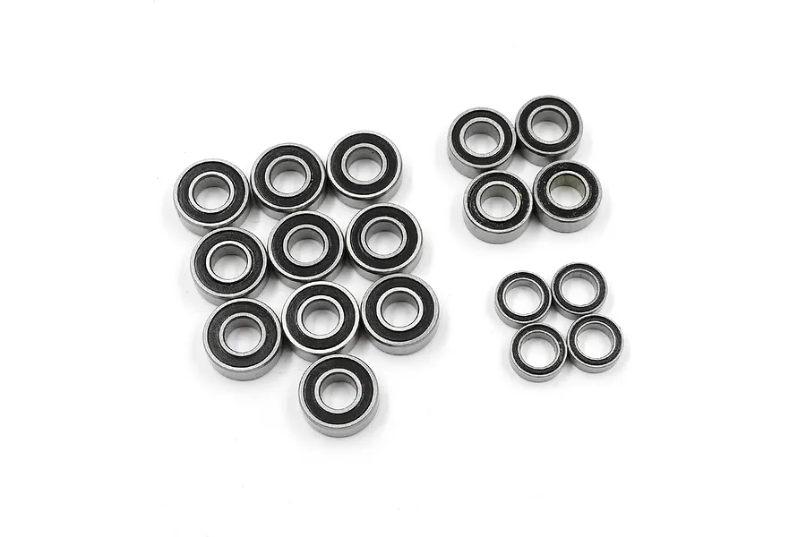 A set of 18 metal ball bearings with black rubber seals arranged on a white background.