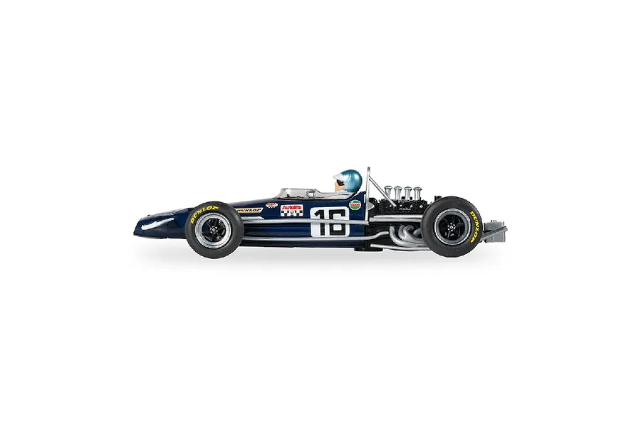 Side profile of a dark blue Scalextric 1/32 scale 1969 Brabham BT26 slot car, number 16, with a driver figure wearing a blue helmet.