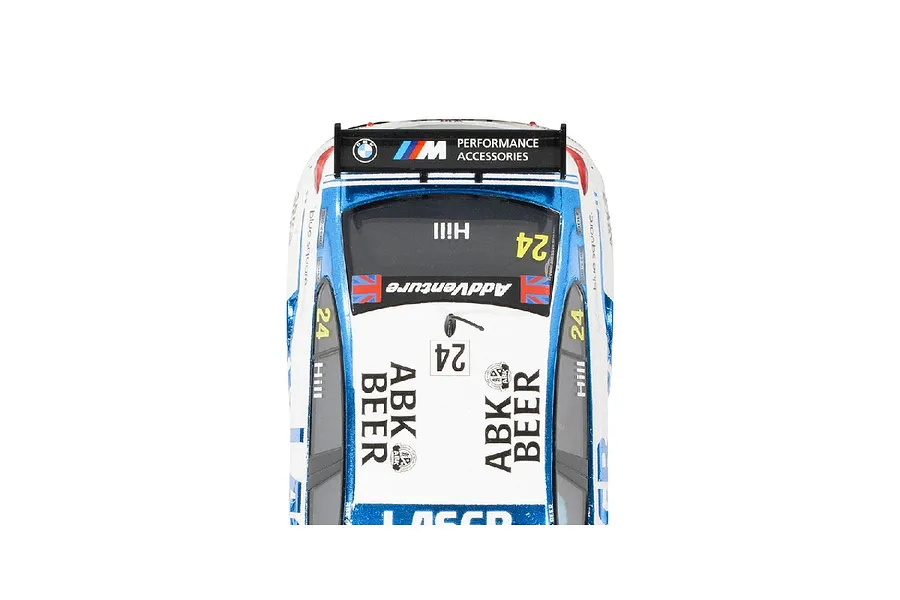 Top-down view of a Scalextric 1/32 scale BMW 330E slot car featuring ABK Beer and Laser Tools branding.