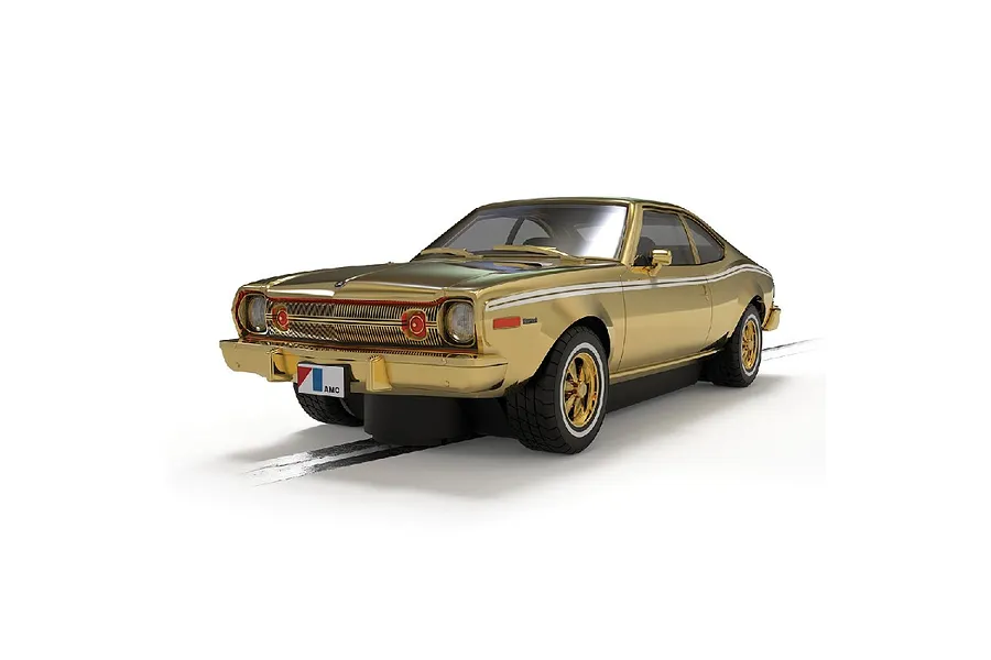 A gold-colored Scalextric 1/32 scale AMC Hornet slot car from The Man With The Golden Gun, shown on a white background.