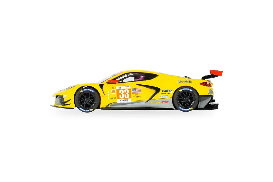 Side profile of a yellow Scalextric 1/32 Chevrolet Corvette C8.R slot car with number 33 livery on a white background.