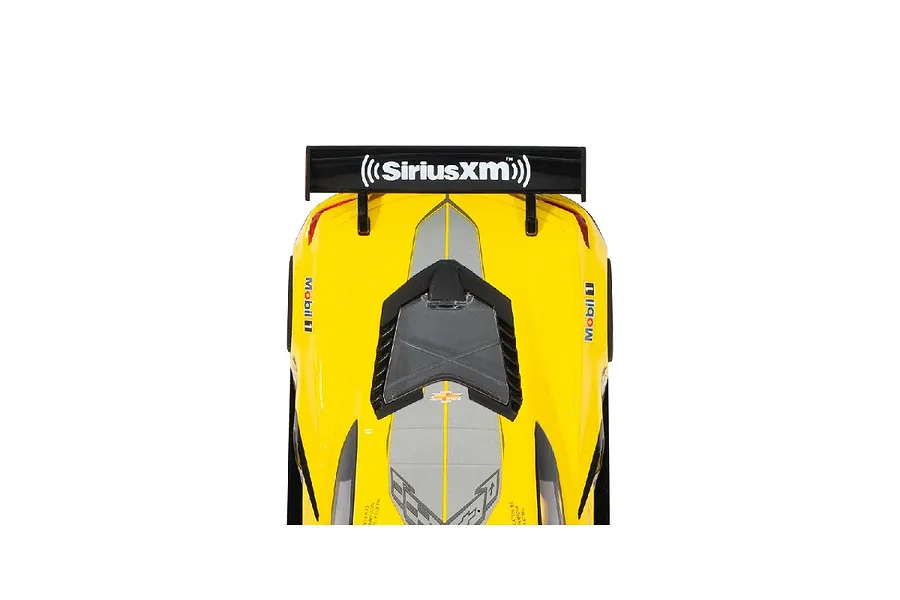 Top-down view of the rear section of a yellow Scalextric Chevrolet Corvette C8.R slot car featuring a black rear wing with SiriusXM branding.
