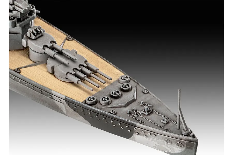 Close-up of the bow section of a Revell 1/1200 scale HMS Duke of York model battleship, showing the deck, main gun turret, and anchor chain details.
