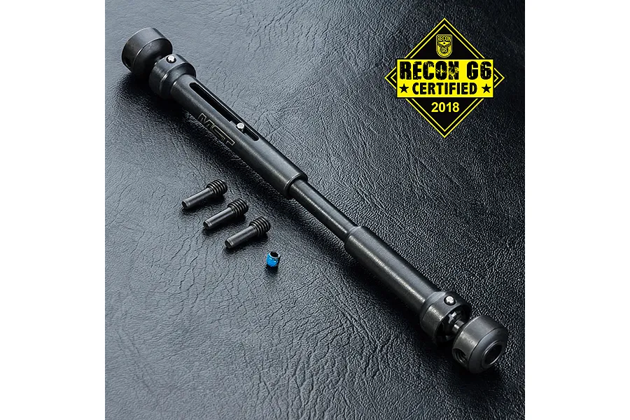 MST steel telescopic CVD driveshaft with included pins and a grub screw on a textured black surface.