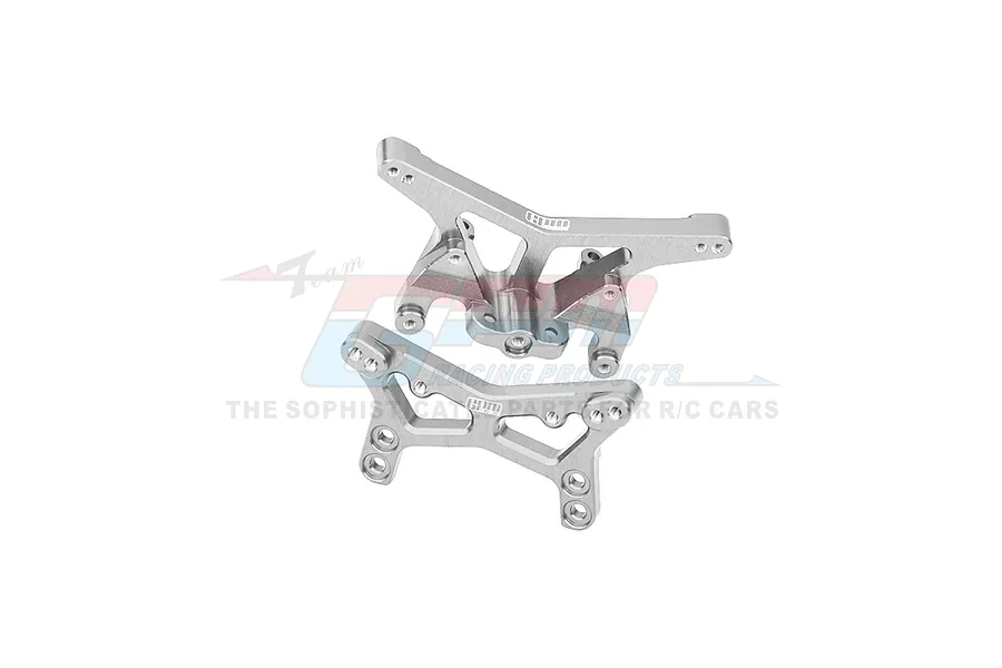 Two silver aluminium RC shock towers from GPM Racing, featuring multiple mounting holes and a branded logo, isolated on a white background.