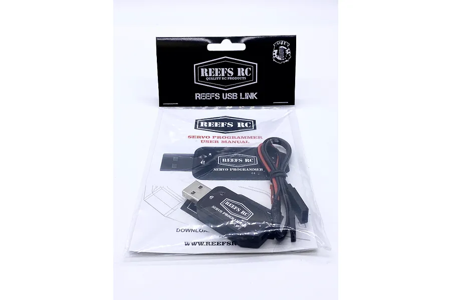 Reefs RC USB Link servo programmer in its original retail packaging with a user manual.