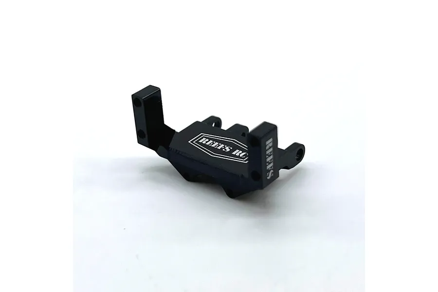 A black anodized aluminium servo mount for RC vehicles with the Reefs RC logo printed on the top surface.