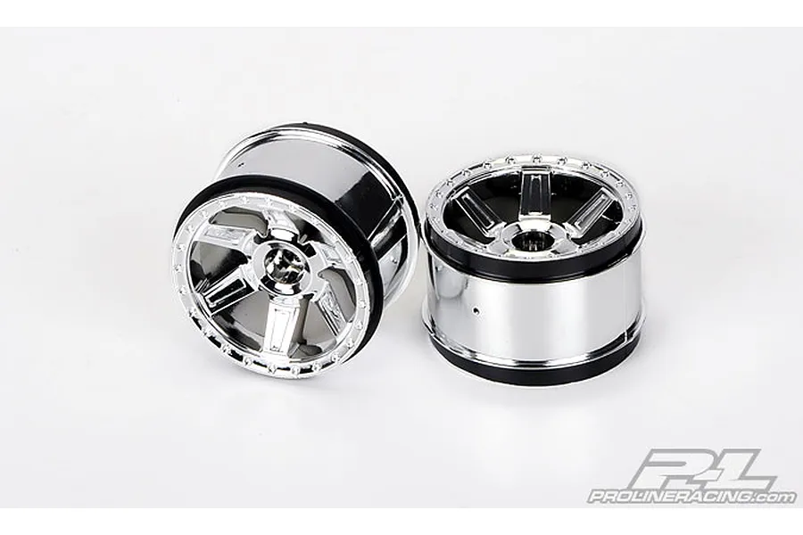 Two Pro-Line 2.8-inch Desperado RC monster truck rims with a shiny chrome finish and black inner barrels.