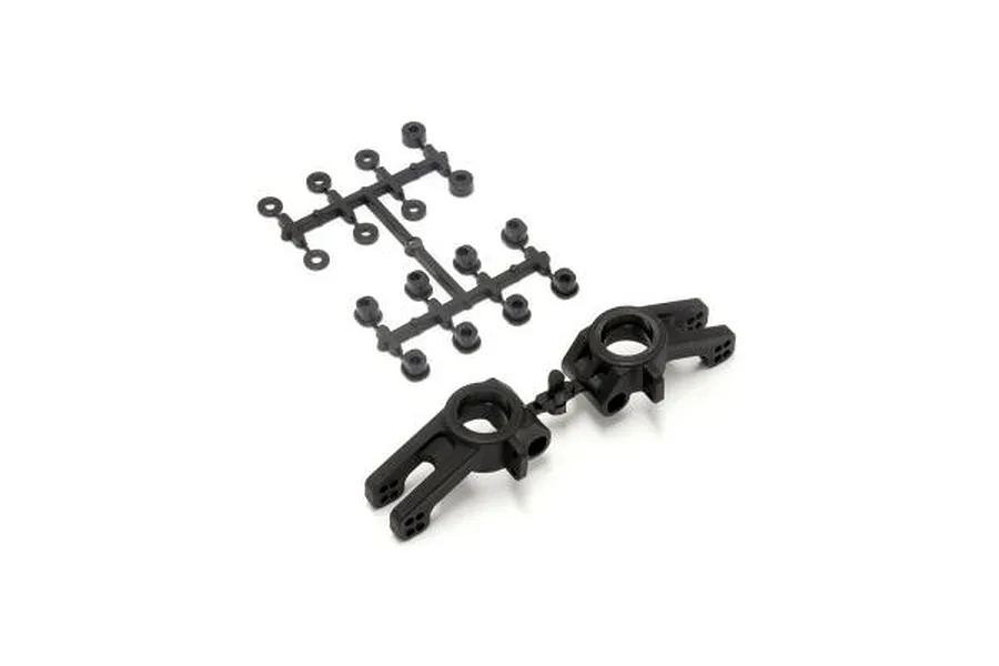 Kyosho black plastic rear hub carriers and associated bushings on a sprue tree.