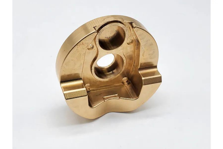 A single brass portal cover component for an RC vehicle, shown from an angled perspective against a white background.