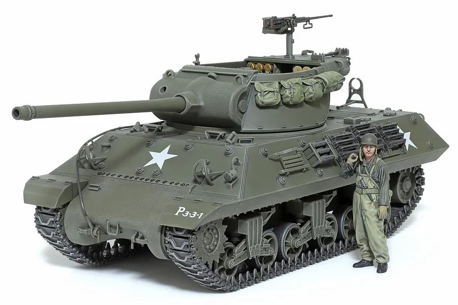 A fully assembled and painted 1/35 scale Tamiya M36 U.S. Tank Destroyer model kit with a crew figure standing beside it on a white background.