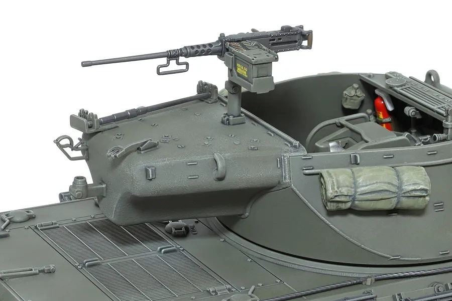 Close-up of a 1/35 scale Tamiya M36 tank destroyer model showing the turret, mounted .50 caliber machine gun, and detailed interior accessories.
