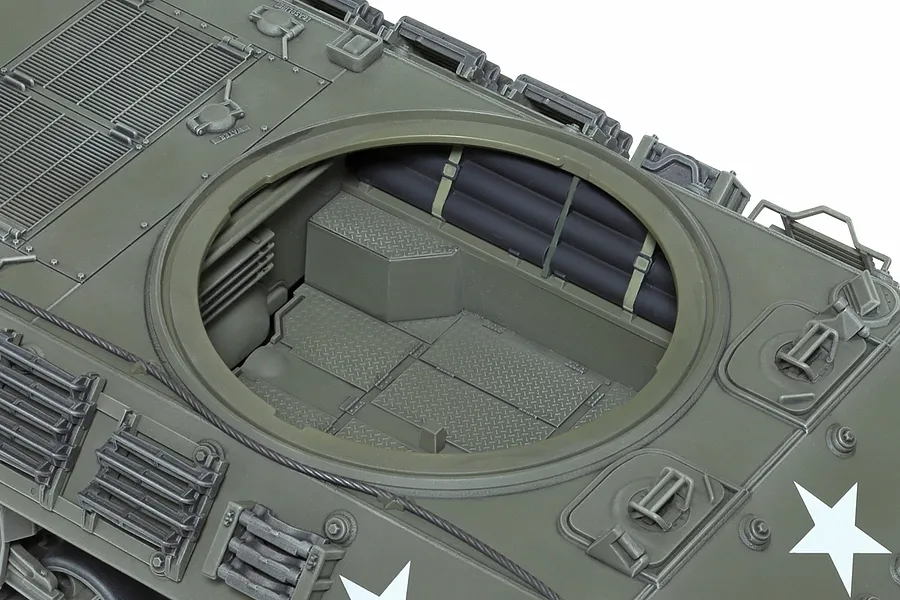 Top-down view of the open turret ring and interior of a Tamiya 1/35 scale M36 U.S. Tank Destroyer plastic model kit, showing detailed floor and storage.