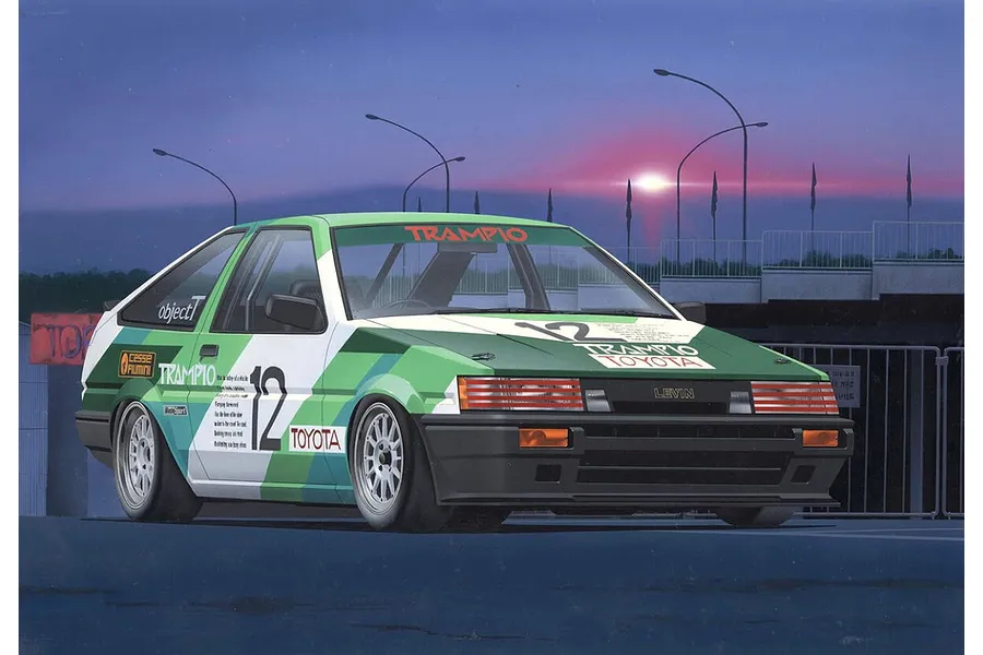 Box art illustration of a green and white Toyota AE86 Levin race car with Trampio livery parked at a track during sunset.