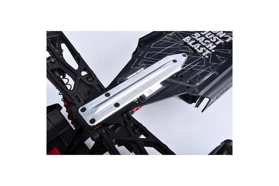 A silver GPM aluminium rear skid plate brace installed on the chassis of an RC vehicle, showing the metal brace secured with screws.