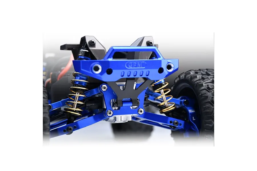 Close-up of a blue anodized aluminium front bumper and bulkhead mount installed on an RC vehicle chassis.