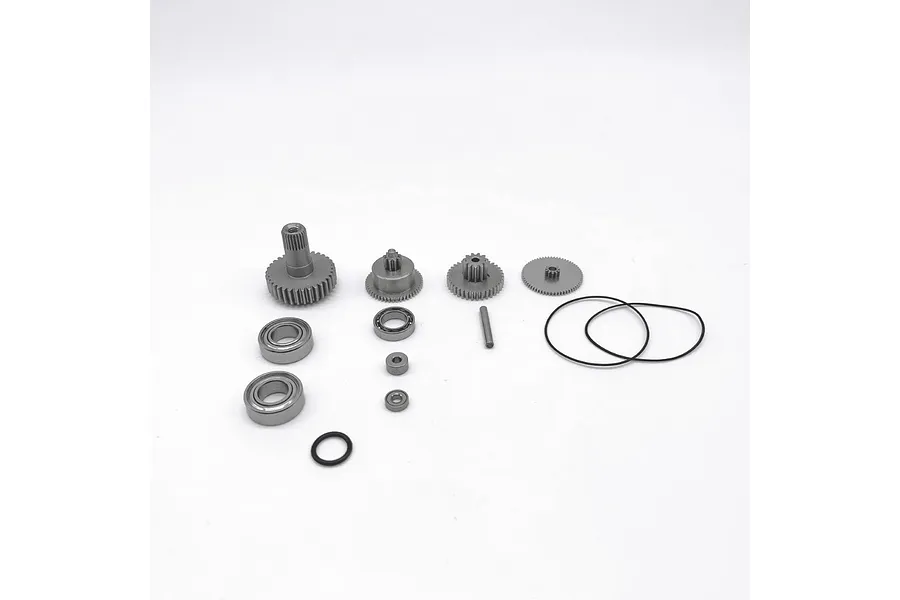 Reefs RC 1400 Smart Gear Set components including metal gears, ball bearings, a pin, and rubber O-rings on a white background.