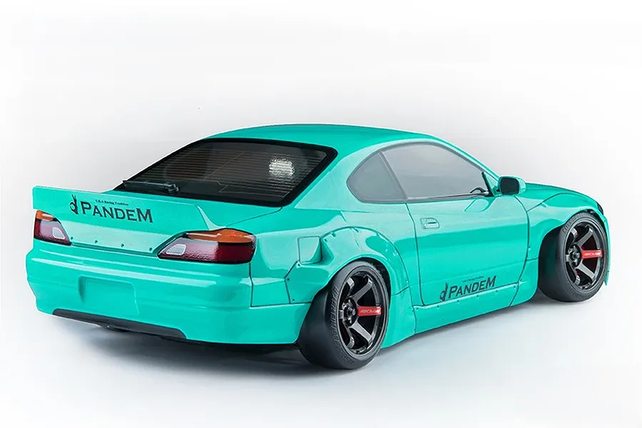 Rear three-quarter view of a mint green MST RMX 2.5 Nissan S15 RC drift car with Pandem widebody kit on a white background.