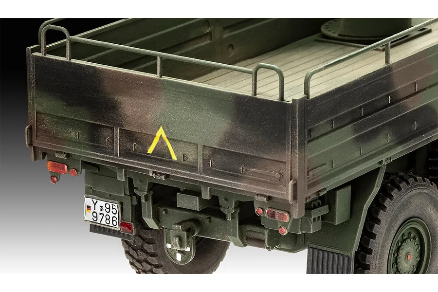 Close-up of the rear cargo bed and tailgate of a 1/35 scale Revell MAN 10T Milgl 8x8 military truck model, featuring camouflage paint and German license plate.