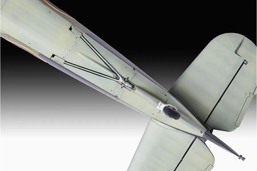 Close-up view of the underside of a scale model aircraft fuselage, showing the tail wheel assembly and panel lines.
