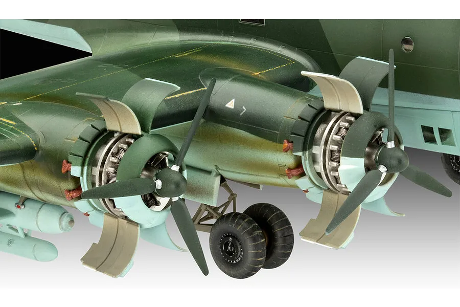 Close-up of the wing, engines, and landing gear of a painted Focke-Wulf Fw 200 Condor plastic model aircraft.