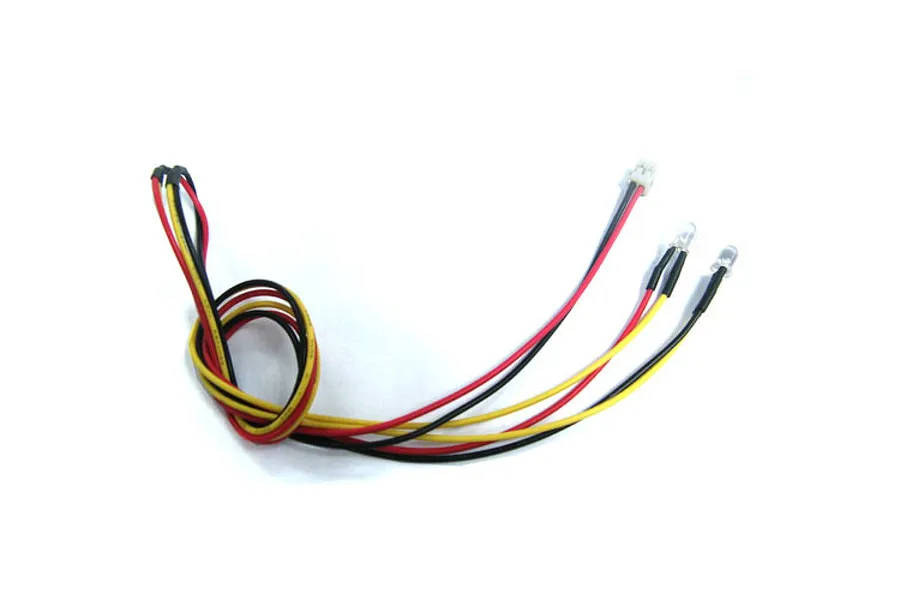 A Yeah Racing 3mm LED light set with yellow bulbs, featuring red and black wires connected to a small white plug.