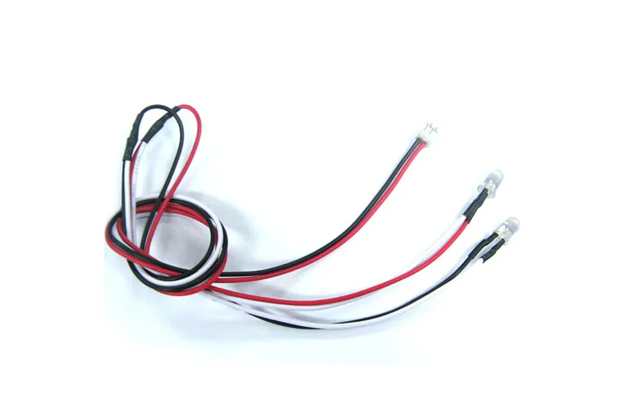 A pair of 5mm white LED lights with red, black, and white wiring connected to a small white plug.