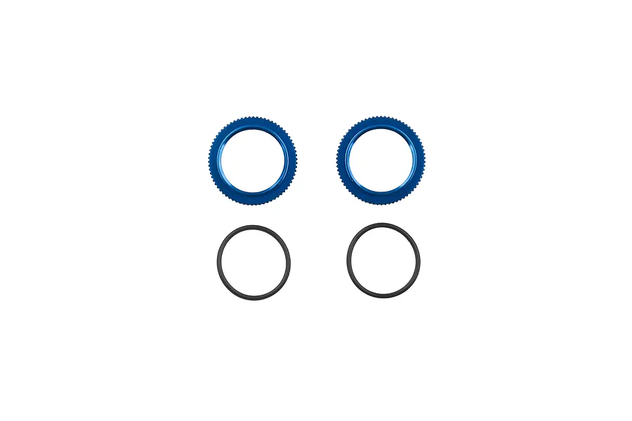 Two blue anodized aluminium shock collars and two black rubber O-rings for RC car suspension, arranged on a white background.