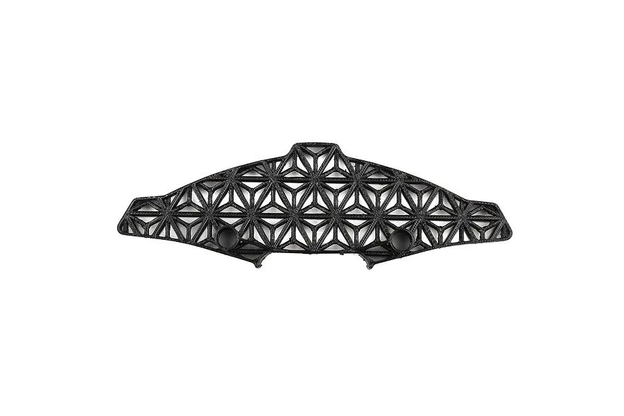 A black 3D-printed TPU RC car bumper with a geometric lattice structure on a white background.