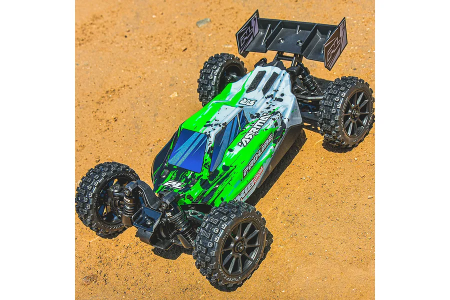 A 1/14 scale RC buggy with a green and white Pro-Line Axis body shell, featuring black splatter patterns, parked on a dirt surface.