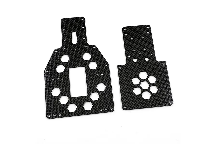 Two black carbon fiber RC chassis plates with hexagonal cutouts on a white background.
