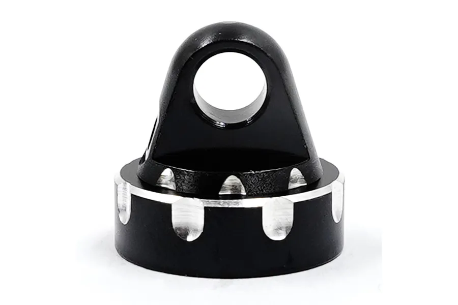 A black anodized aluminium RC shock cap with a mounting eyelet and scalloped edges on a white background.