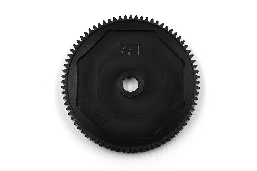 A black Delrin 77T spur gear for RC cars, featuring a central mounting hole and molded 77T text on the face.