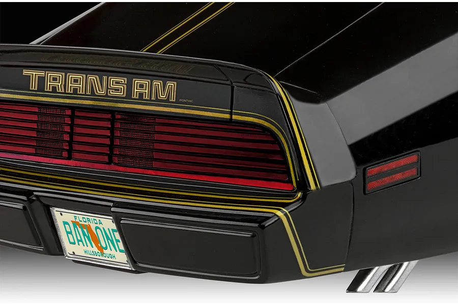Close-up of the rear end of a black Revell Pontiac Firebird Trans Am model car with gold decals and a Florida license plate.