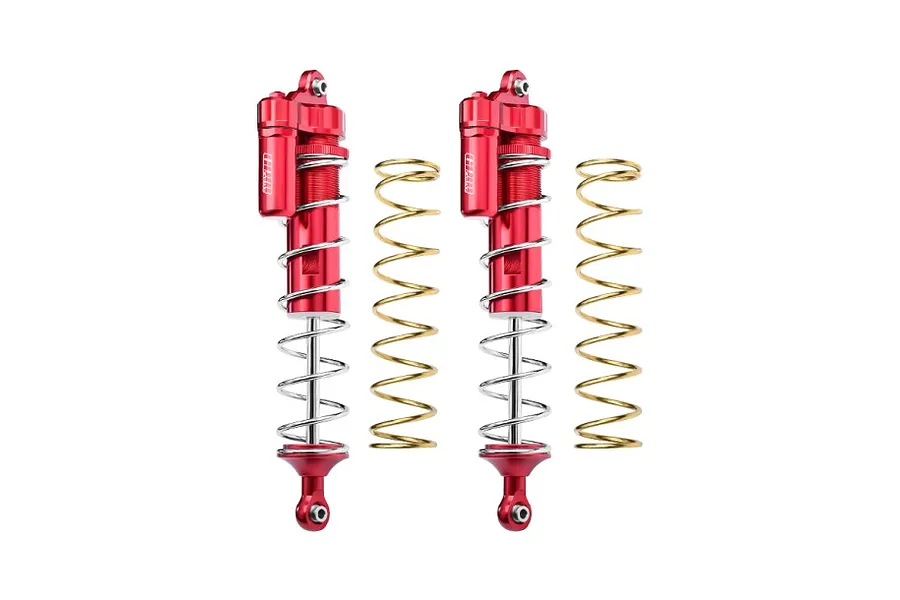 Two red GPM Racing aluminium piggyback shock absorbers with silver springs and two additional gold-coloured springs on a white background.