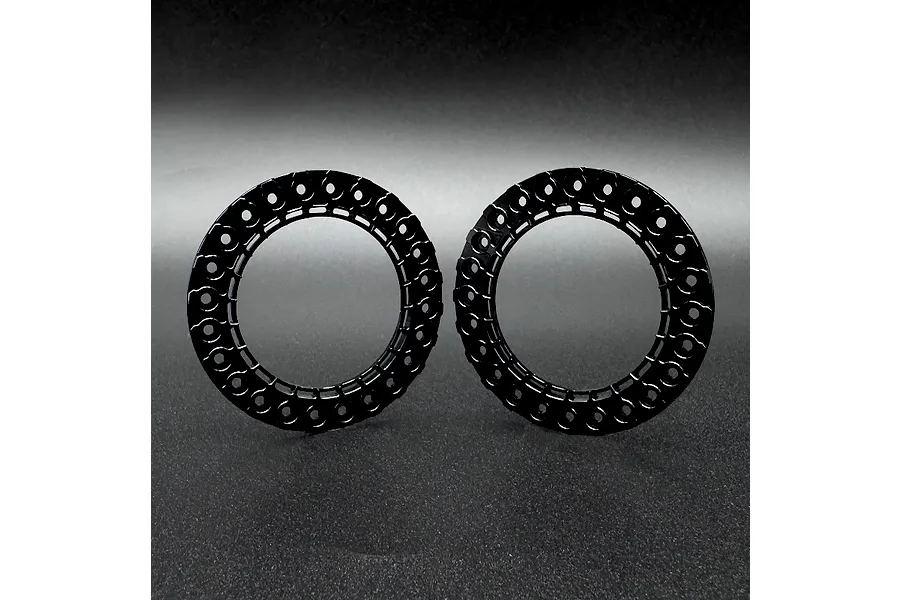 Two black aluminium beadlock rings for 1.9 inch RC wheels, shown side by side against a dark grey background.