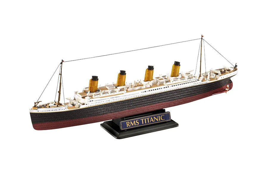 A fully assembled plastic model of the RMS Titanic on a black display stand against a white background.