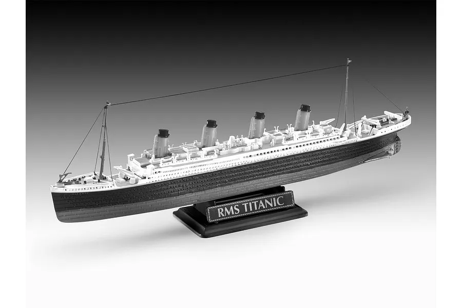 A completed plastic model of the RMS Titanic on a black display stand against a grey gradient background.