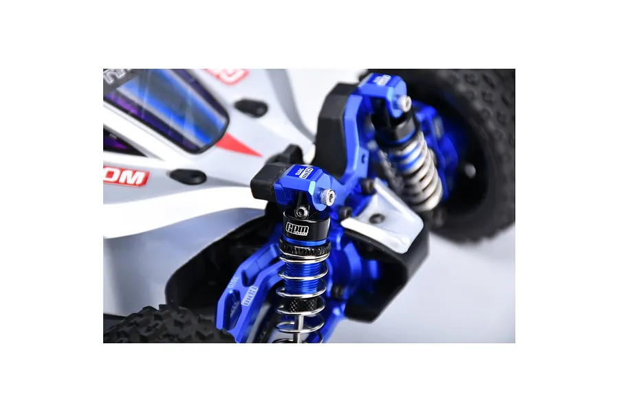 Close-up of a blue GPM Racing aluminium shock cap protector installed on an RC car suspension system.