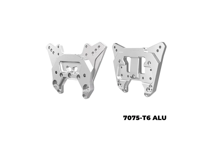 Two silver GPM Racing aluminium shock towers for RC vehicles against a white background.