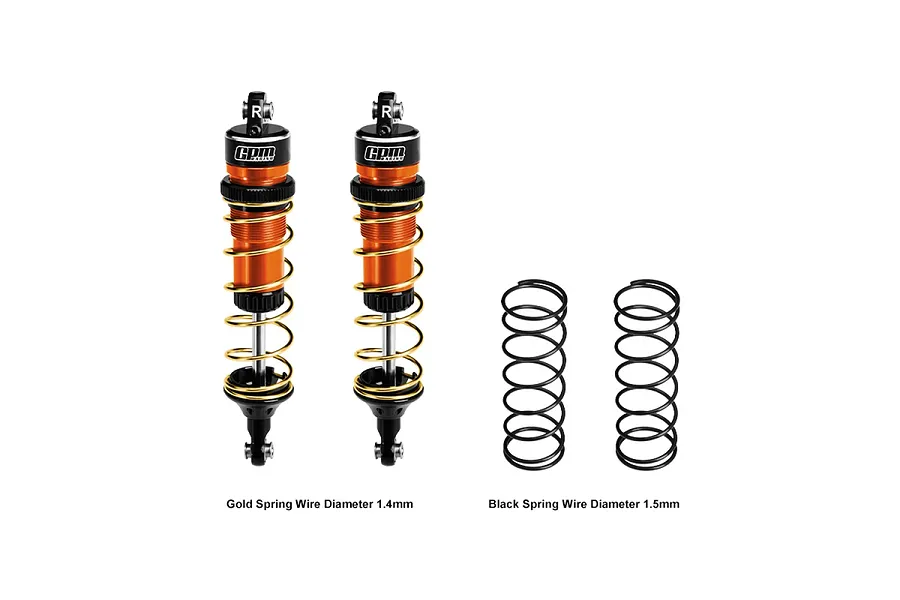 Two GPM Racing orange aluminium adjustable RC shock absorbers with gold springs, plus two additional black springs, on a white background.