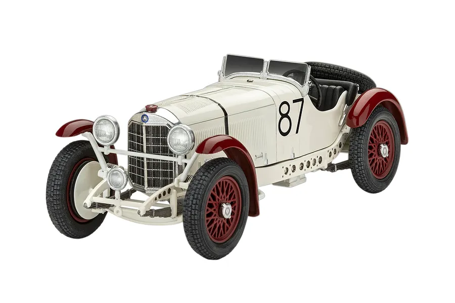 A completed 1/32 scale plastic model of a vintage Mercedes-Benz SSKL race car, painted white with red fenders and wheels, featuring the number 87.