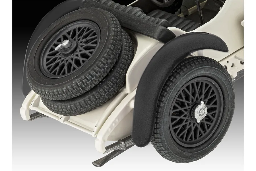Close-up of the rear section of a Revell 1/32 Mercedes-Benz SSKL model car, showing the spare tire, rear wheel, and fender.