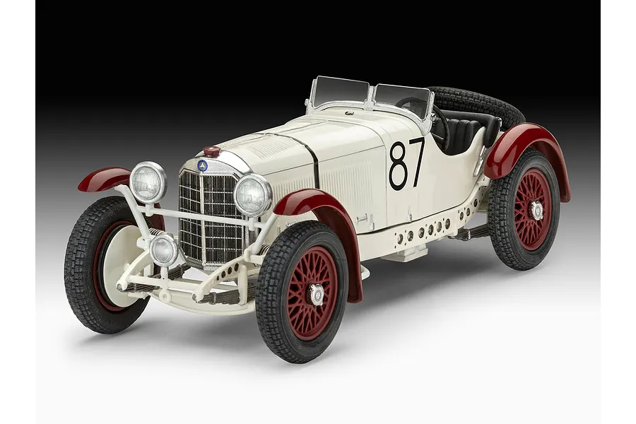 A 1/32 scale model of a vintage white and maroon Mercedes-Benz SSKL race car with the number 87 on the side.
