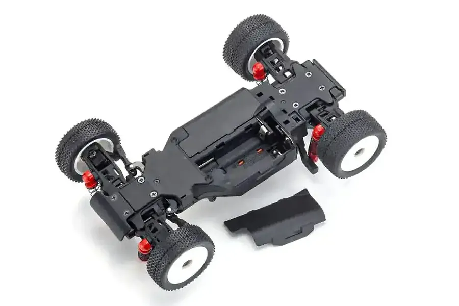 Top-down view of a Kyosho Mini-Z MB-010VE 2.0 RC buggy chassis with the battery compartment cover removed, set against a white background.