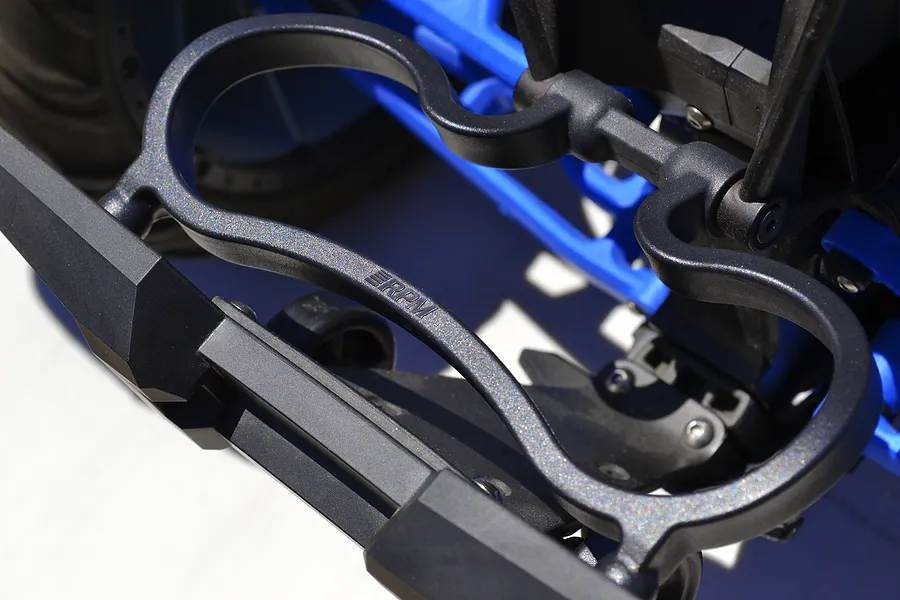 Close-up of an RPM branded black plastic rear bumper mount installed on an RC vehicle chassis.